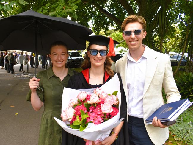 Emma Darmody, Dr Hannah Armstrong (MD Doctor of Medicine/Master of Public Health) and Jack Francis at the University of Melbourne graduations held at the Royal Exhibition Building on Saturday, December 7, 2024. Picture: Jack Colantuono