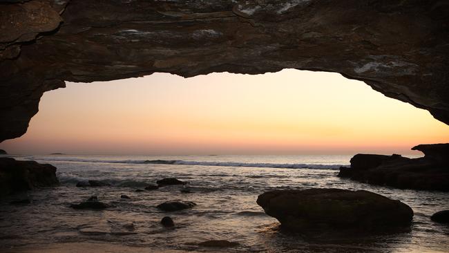 Sunrise from inside Lake Macquarie’s Caves Beach. Picture: Chris Pavlich