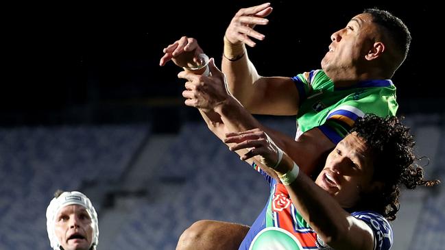 AUCKLAND, NEW ZEALAND - JULY 21: Dallin Watene-Zelezniak of the Warriors ands Albert Hopoate of the Raiders contest the ball  during the round 21 NRL match between the Warriors and the Raiders at Go Media Stadium on July 21, 2023 in Auckland, New Zealand. (Photo by Phil Walter/Getty Images)