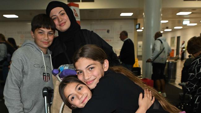 Racha Ismal with her children Leila 5, Rayann 10 and Yusef 10 arrive in Brisbane this week after fleeing Lebanon. Picture: Lyndon Mechielsen