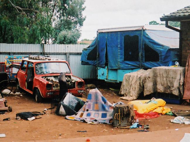 Police prosecution evidence pictures of the Parafield Gardens, criminal neglect Supreme Court case. Damaged property, house and yard full of waste where children were cruelly treated.