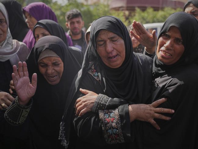 Palestinians mourn during the funeral of Reem Al-Akhras who was killed while heading to a Gaza aid hub. Picture: AP Photo