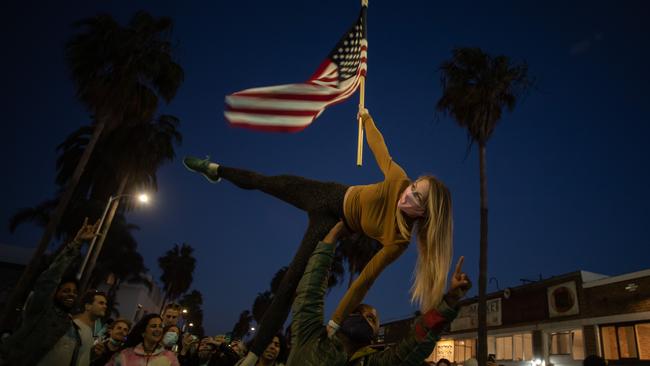 People dance in the Venice Beach neighbourhood of Los Angeles as they celebrate after Joe Biden was declared winner of the 2020 presidential election. Picture: AFP