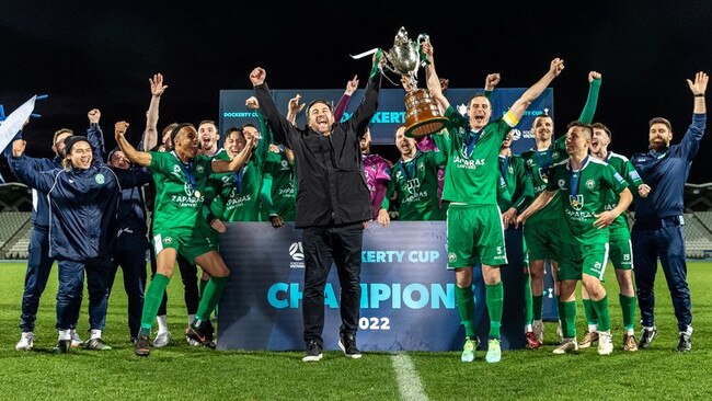 Nick Tolios lifts the Dockerty Cup with captain Jack Webster in celebration. (Football Victoria)