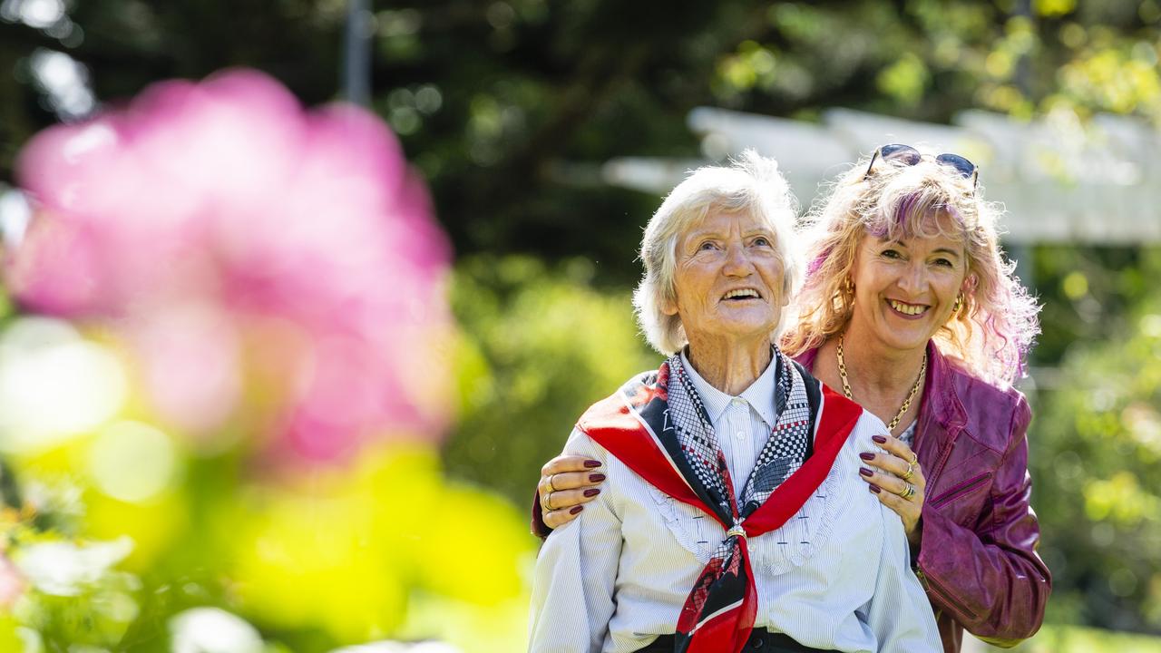 Avalyn Alldridge gets a cuddle from her daughter Robyn Alldridge during Mother's Day celebrations in the Queensland State Rose Garden, Newtown Park, Sunday, May 8, 2022. Picture: Kevin Farmer