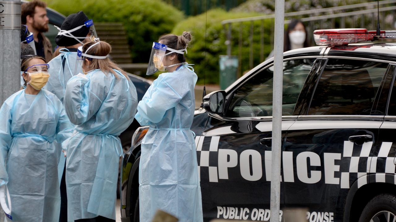 Medical staff prepare to enter the Flemington public housing estate after it was put into lockdown on Saturday. Picture: NCA NewsWire/Andrew Henshaw