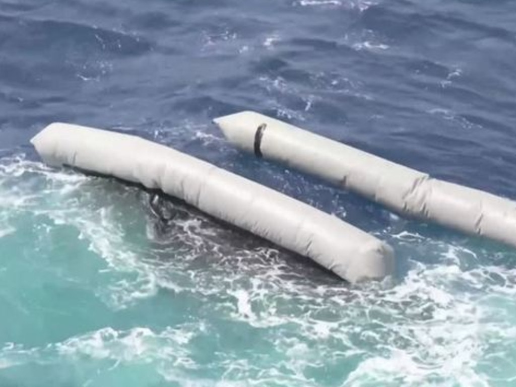 The remains of the boat packed with a suspected 130 migrants shipwrecked off Libya.