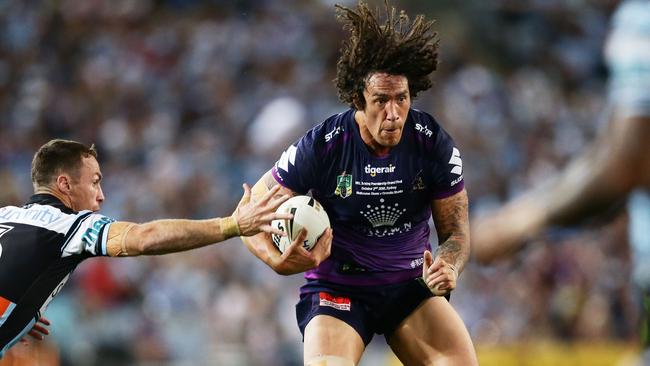 Kevin Proctor of the Storm takes on the defence during the 2016 NRL Grand Final match between the Cronulla Sharks and the Melbourne Storm. Photo: Getty Images