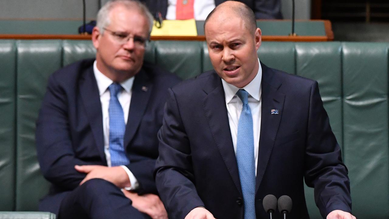 Prime Minister Scott Morrison (left) listens as Treasurer Josh Frydenberg delivers the Budget on Wednesday night in the House of Representatives. Picture: Sam Mooy/Getty Images