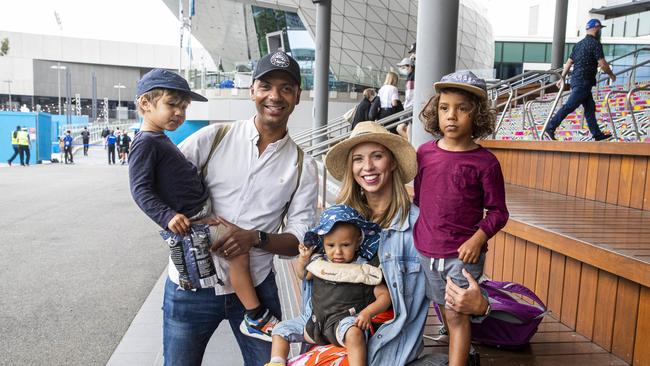 08/02/21 Ellie and Marcus Cumberpatch with their kids Jasper (4), Caspian (3) and Nia (1) at the Australian open on day one of the tournament. Aaron Francis/The Australian