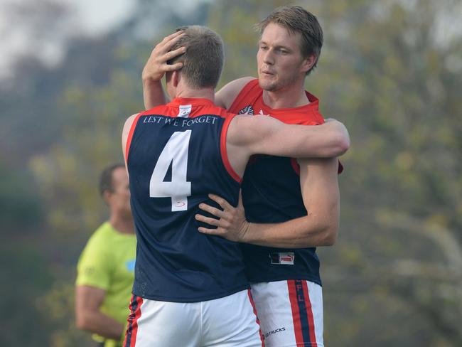 Sam Gibson celebrates a goal in the last quarter with Jordan Bastinac. Picture: Chris Eastman/AAP