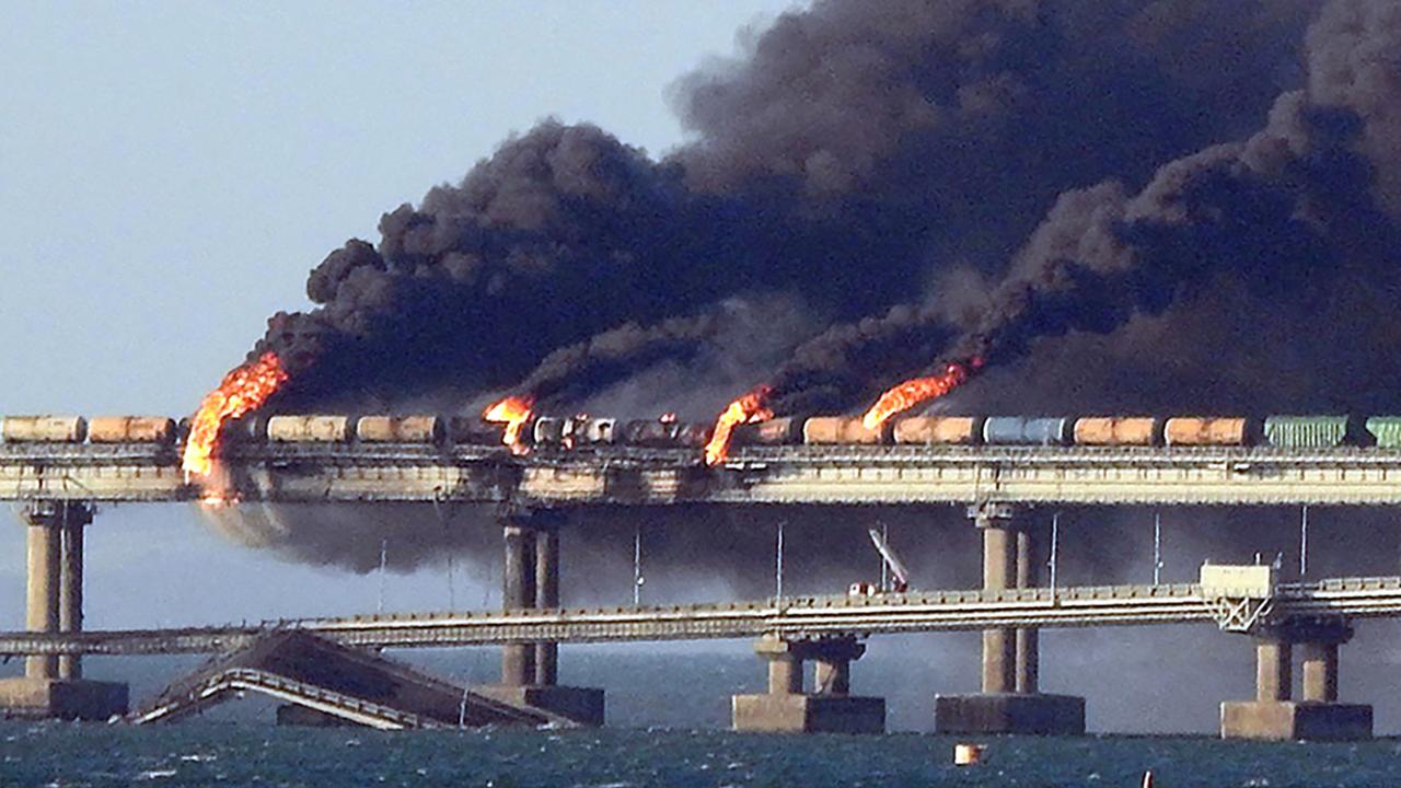 Black smoke billows from a fire on the Kerch bridge that links Crimea to Russia, after a truck exploded on October 8, 2022. Picture: AFP