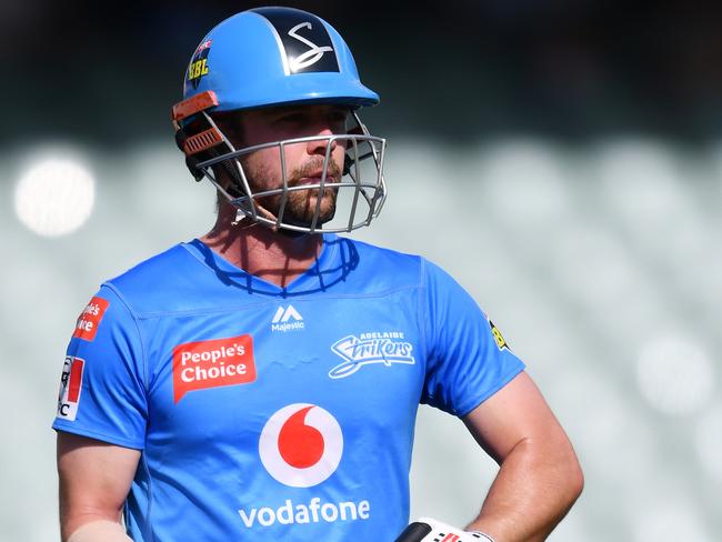 ADELAIDE, AUSTRALIA - JANUARY 24: Travis Head  of the Strikers out off the bowlers hand during the Big Bash League match between the Sydney Thunder and the Adelaide Strikers at Adelaide Oval, on January 24, 2021, in Adelaide, Australia. (Photo by Mark Brake/Getty Images)