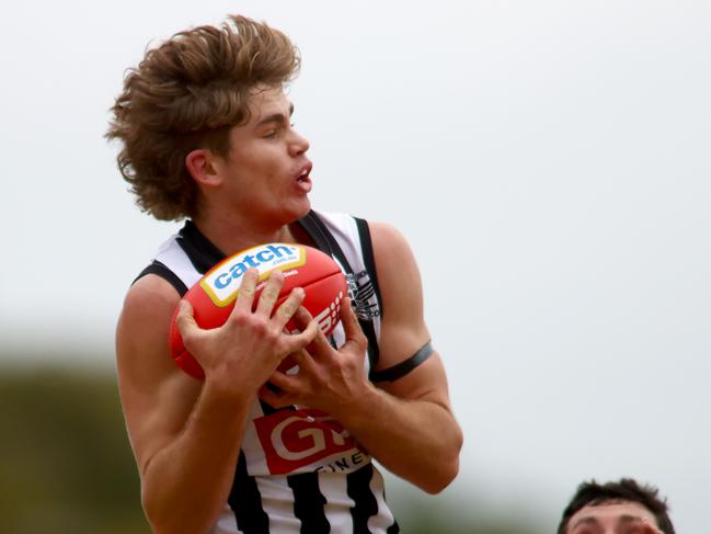 Max Hodges of Payneham Norwood Union marks the ball. Adelaide Footy league division one - Payneham Norwood Union v Price Alfred Old Collegiansat Payneham Oval. Photo Kelly Barnes