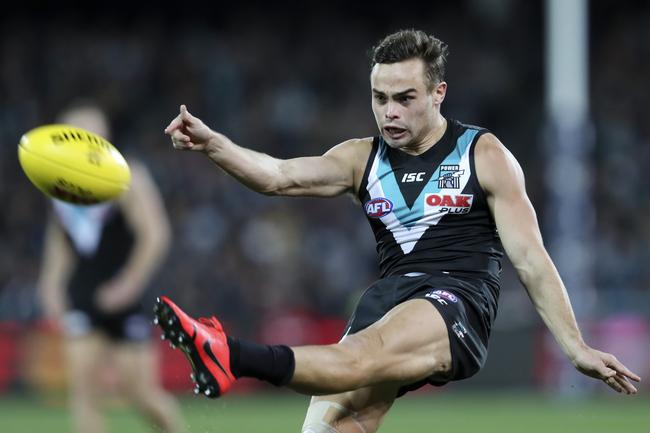 Port Adel;aide’s Karl Amon kicks the football forward in Showdown 46 at Adelaide Oval. Picture: Sarah Reed