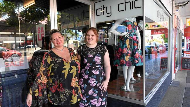 CITY CHIC: Store manager Lee McPhee and sales assistant Cassie Dallarizza outside the new store. Picture: Mike Knott BUN260717CITYCHIC4