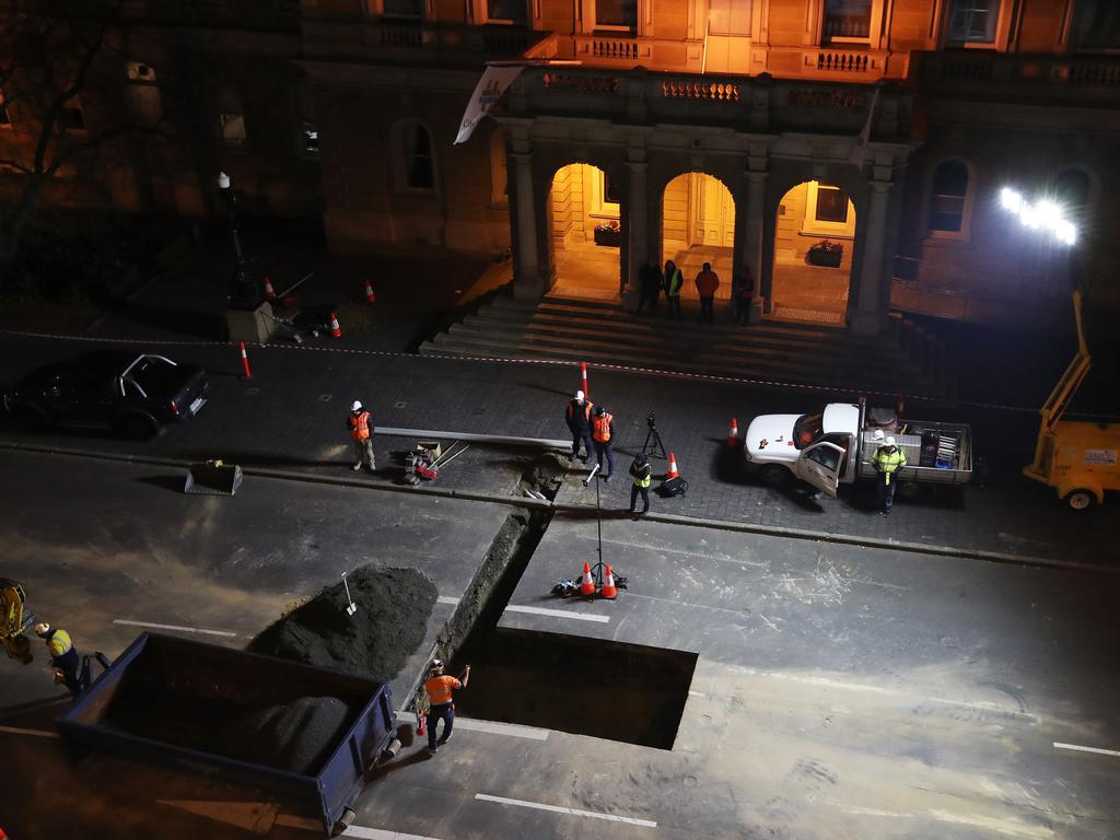 Work in Macquarie Street Hobart on the hole that will house the chamber performance artist Mike Parr will live in for 72 hours during Dark MOFO. Picture: NIKKI DAVIS-JONES