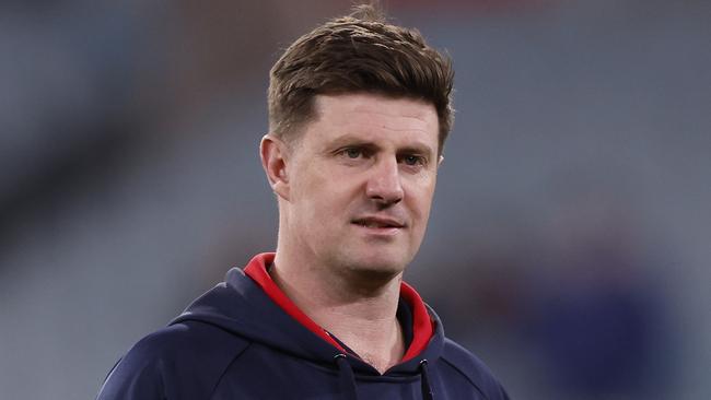 MELBOURNE, AUSTRALIA - AUGUST 23: Melbourne assistant coach Andrew McQualter looks on before during the round 24 AFL match between Melbourne Demons and Collingwood Magpies at Melbourne Cricket Ground, on August 23, 2024, in Melbourne, Australia. (Photo by Darrian Traynor/Getty Images)