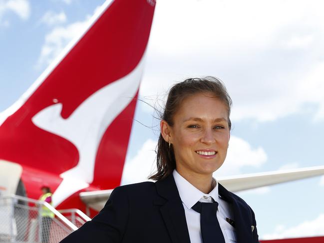 DAILY TELEGRAPH - 17/12/20Qantas Freight pilot Kate English pictured on the tarmac at Sydney Domestic airport today. Picture: Sam Ruttyn