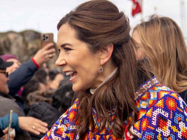 Denmark's Queen Mary (R) meets with local residents upon arriving in Sisimiut, Greenland, on July 2, 2024. The royal couple officially visits Greenland from the 29th of June to the 6th of July 2024. (Photo by Ida Marie Odgaard / Ritzau Scanpix / AFP) / Denmark OUT