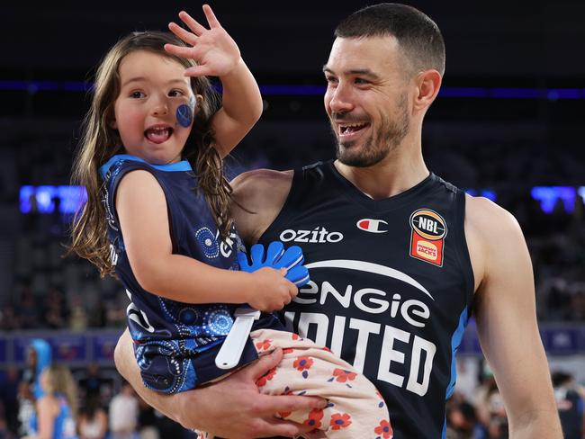 Melbourne United’s Chris Goulding celebrates with hs daughter after playing his 450th game earlier this season. Picture: Getty Images