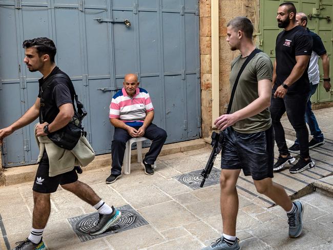 An Israeli off duty soldier walks with a riffle in the Old City of Jerusalem. Picture: AFP