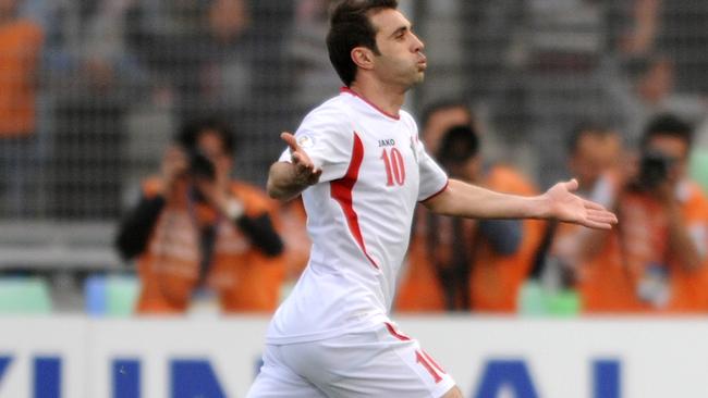 AMMAN, JORDAN - MARCH 26: Ahmed Hayel of Jordan celebrates kicking a goal during the FIFA World Cup Asian qualifier match between Jordan and Japan at King Abdullah International Stadium on March 26, 2013 in Amman, Jordan. (Photo by Kaz Photography/Getty Images)