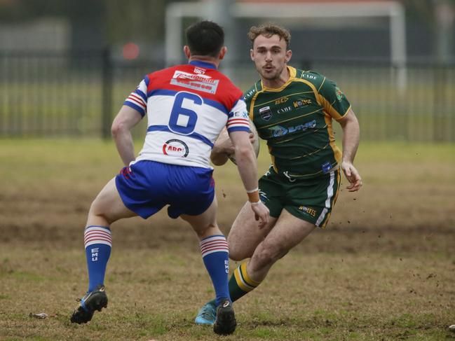 Isaac Thompson (No.6) about to make a tackle. Picture Warren Gannon Photography