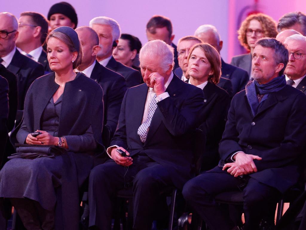 King Charles wipes away tears during the emotional commemorations to mark the 80th anniversary of the liberation of the Auschwitz-Birkenau concentration camp. Picture: AFP