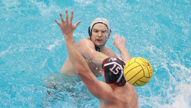 Action between the UNSW Wests Magpies (white caps) and Drummoyne Devils (black caps).