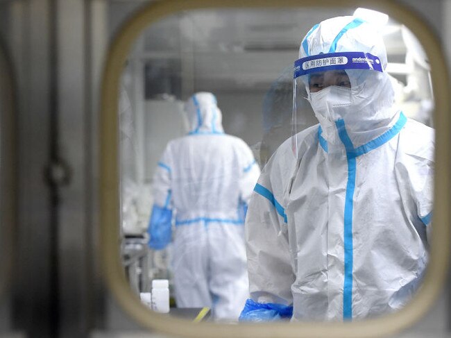 WUHAN, CHINA - AUGUST 05 2021: People in PPE work in the Huo-Yan (Fire Eye) Laboratory designed for high-capacity 2019-nCoV (SARS-CoV-2) detection in Wuhan in central China's Hubei province Thursday, Aug. 05, 2021. (Photo credit should read Feature China/Barcroft Media via Getty Images)