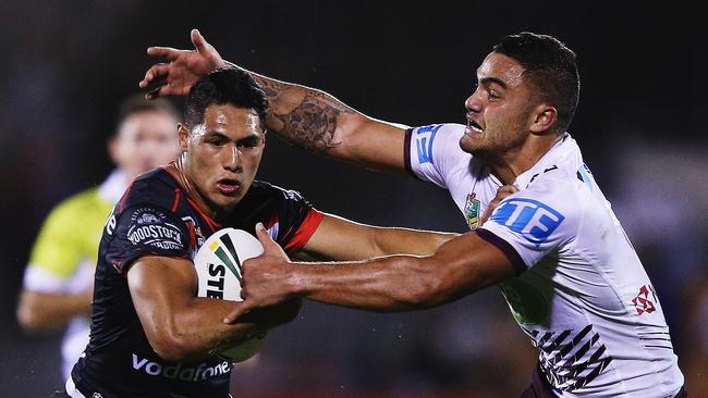 AUCKLAND, NEW ZEALAND - APRIL 09: Roger Tuivasa-Sheck of the Warriors fends off Dylan Walker of the Sea Eagles during the round six NRL match between the New Zealand Warriors and the Manly Sea Eagles at Mt Smart Stadium on April 9, 2016 in Auckland, New Zealand. (Photo by Hannah Peters/Getty Images)