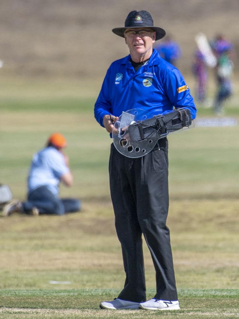 While fellow official Bruce Oxenford opts for a forearm shield in the middle.