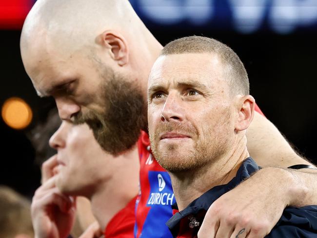 MELBOURNE, AUSTRALIA - SEPTEMBER 07: Simon Goodwin, Senior Coach of the Demons and Max Gawn of the Demons pause for the national anthem during the 2023 AFL First Qualifying Final match between the Collingwood Magpies and the Melbourne Demons at Melbourne Cricket Ground on September 07, 2023 in Melbourne, Australia. (Photo by Michael Willson/AFL Photos via Getty Images)