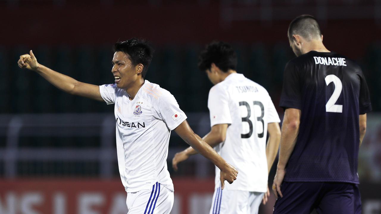 Marinos’ goalscorer Takuma Nishimura celebrates as Sydney FC defender James Donachie bows his head in despair. Picture: Minh Hoang/Getty Images