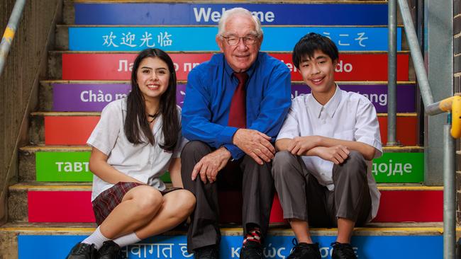 John Quinnell, a teacher of 60 years, with Kogarah High School Intensive English Centre students Laura Sofia Umbarila and Jerry Tang. Picture: Justin Lloyd.