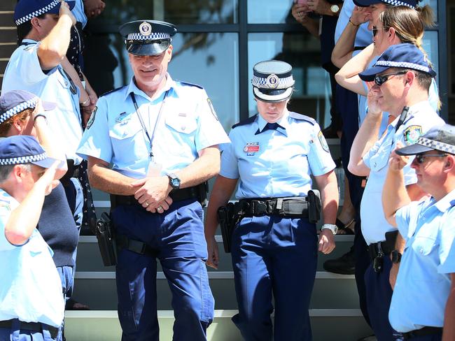 Sen Con leaves Wyong Police Station under a guard of honour. (AAP Image/Sue Graham)