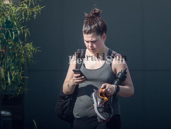 Disgraced wellness blogger Belle Gibson walks from the Reservoir Leisure Centre. Picture: Jake Nowakowski