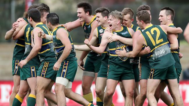 Pembroke players celebrate their 2016 division three grand final win over Athelstone. Picture: Calum Robertson