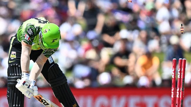 HOBART, AUSTRALIA – JANUARY 15: David Warner of the Thunder is bowled by Riley Meredith of the Hurricanes during the Men's Big Bash League match between the Hobart Hurricanes and the Sydney Thunder at Blundstone Arena, on January 15, 2023, in Hobart, Australia. (Photo by Steve Bell/Getty Images)