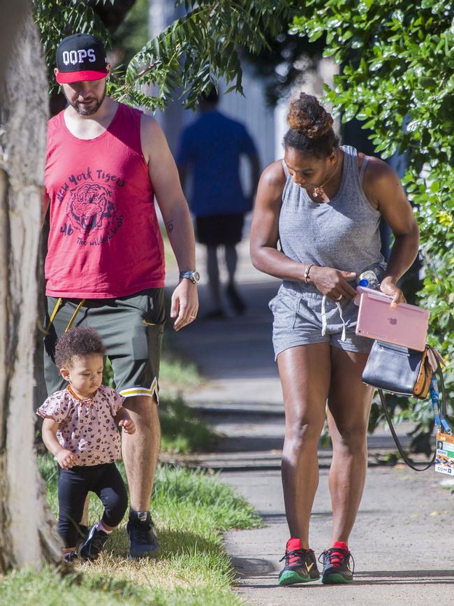 Serena Williams and her husband Alexis Ohanian enjoy an afternoon walk with their 1-year-old daughter Alexia Olympia. Serena's daughter looked seriously cute, toddling her way down the footpath, wearing Nike sneakers like her Mummy. Picture: MediaMode