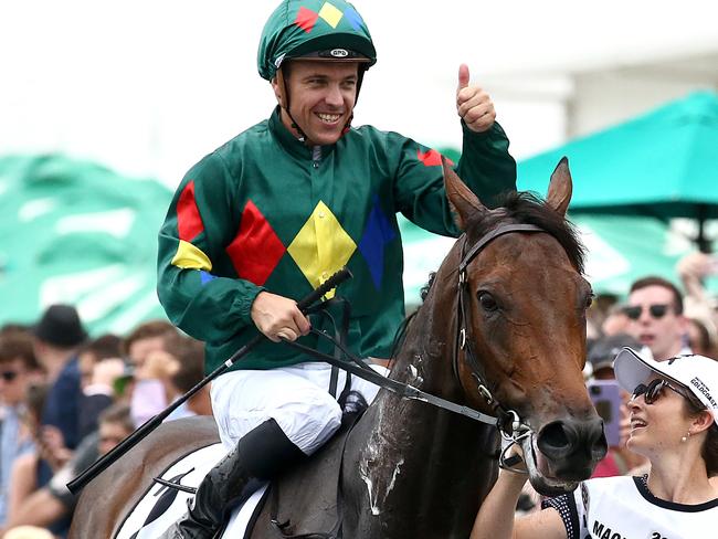 Jockey Ryan Maloney celebrates after riding Alligator Blood to victory in race 6, the Magic Millions 3YO Guineas, during Magic Millions Race Day at Aquis Park on the Gold Coast. Saturday, January 11, 2020. (AAP Image/Jono Searle) NO ARCHIVING, EDITORIAL USE ONLY