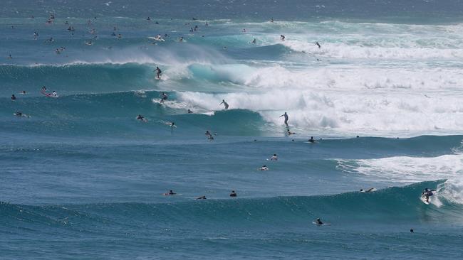 Surfers crowd the waves at Snapper Rocks. PIC: Adam Head