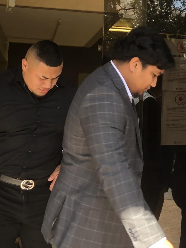 William Papaliitele (in black suit) and Patric Pasikala (front) leave Parramatta Local Court.
