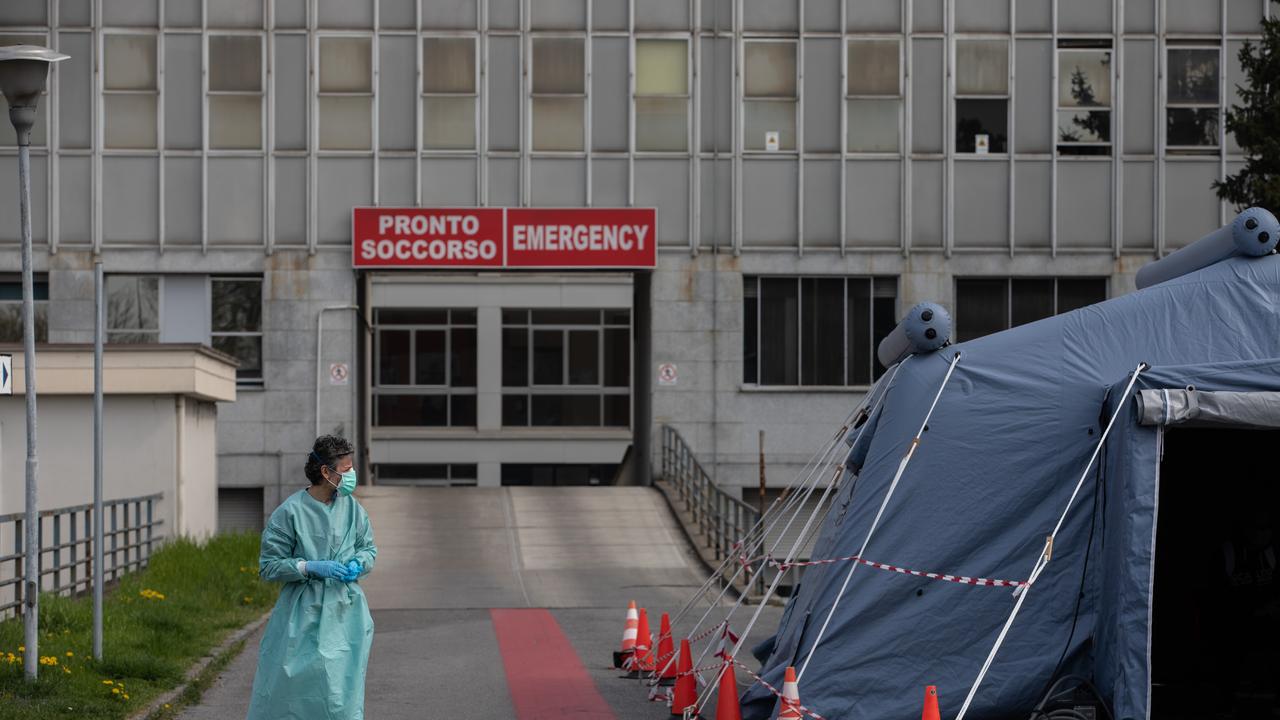 A nurse stands next to a pre-triage tent in front of the Emergency Room of the local hospital in Cremona, near Milan, Italy. Picture: Emanuele Cremaschi/Getty Images