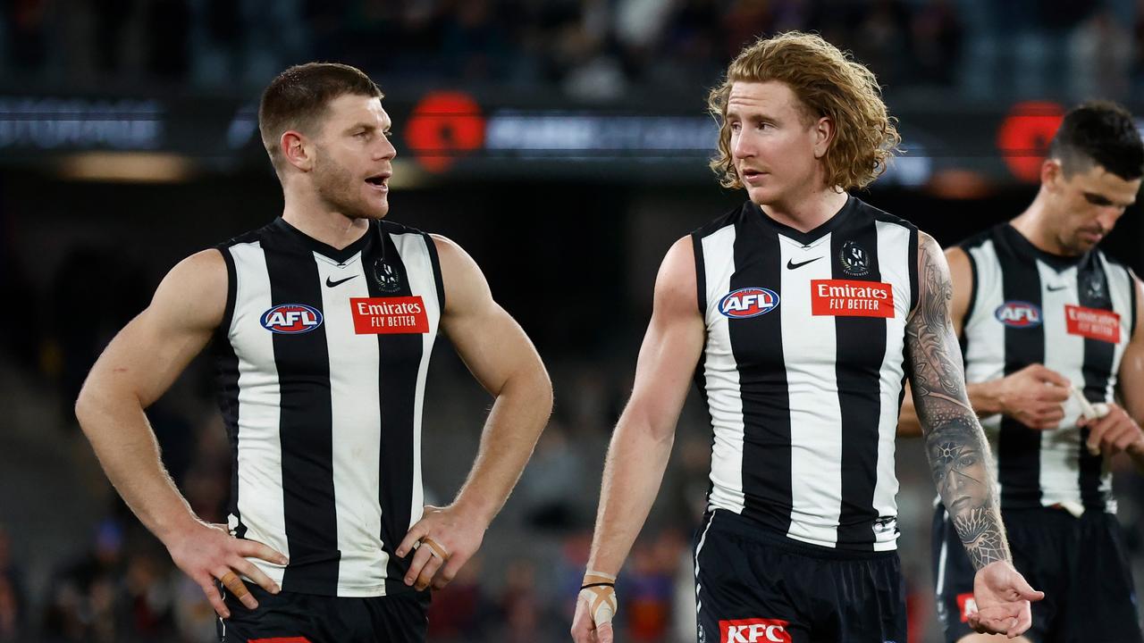 MELBOURNE, AUSTRALIA – AUGUST 18: Taylor Adams (left) and Beau McCreery of the Magpies look dejected after a loss during the 2023 AFL Round 23 match between the Collingwood Magpies and the Brisbane Lions at Marvel Stadium on August 18, 2023 in Melbourne, Australia. (Photo by Michael Willson/AFL Photos via Getty Images)