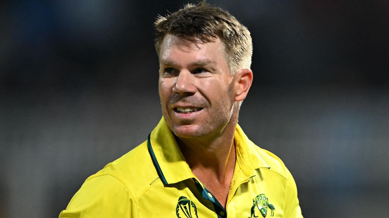 David Warner walks back to the pavilion after his dismissal. (Photo by DIBYANGSHU SARKAR / AFP)