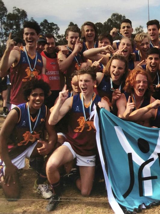 Quaynor (left, front row) celebrates Beverley Hills' YJFL premiership in 2016. Picture: Supplied