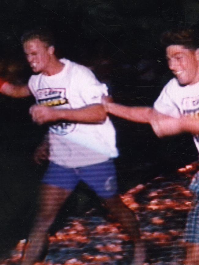 Nigel Smart walks over hot coals during motivational exercise that went wrong at an Adelaide Crows pre-season camp in 1992.