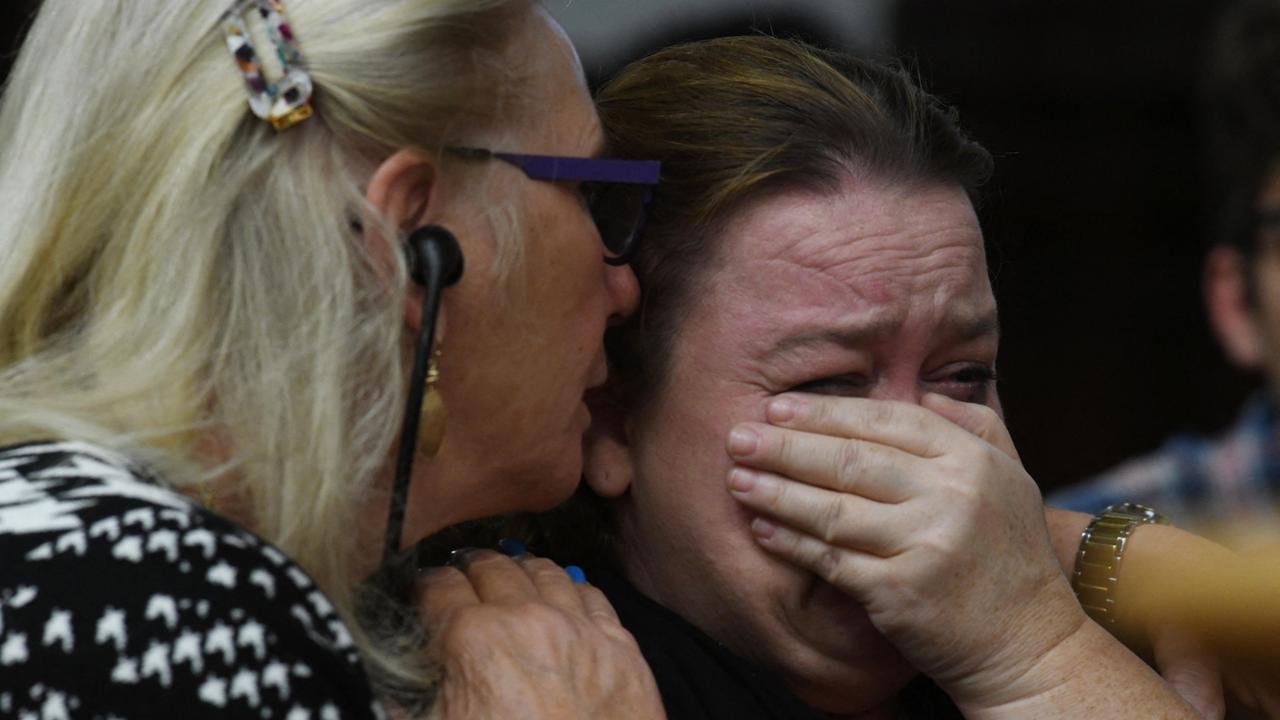 Kyle Rittenhouse's mother Wendy Rittenhouse (right) is comforted by a defence jury expert during her son’s trial. Picture: Pool / Getty Images via AFP